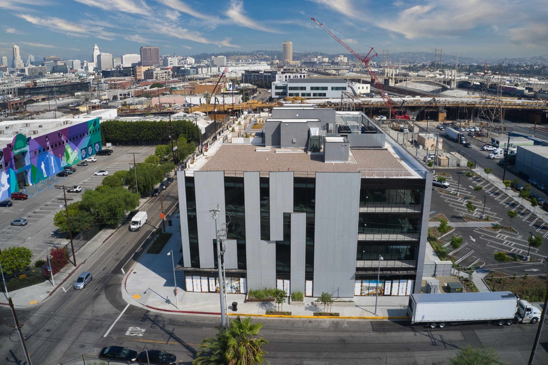 Aerial architectural photograph of a completed white and charcoal building