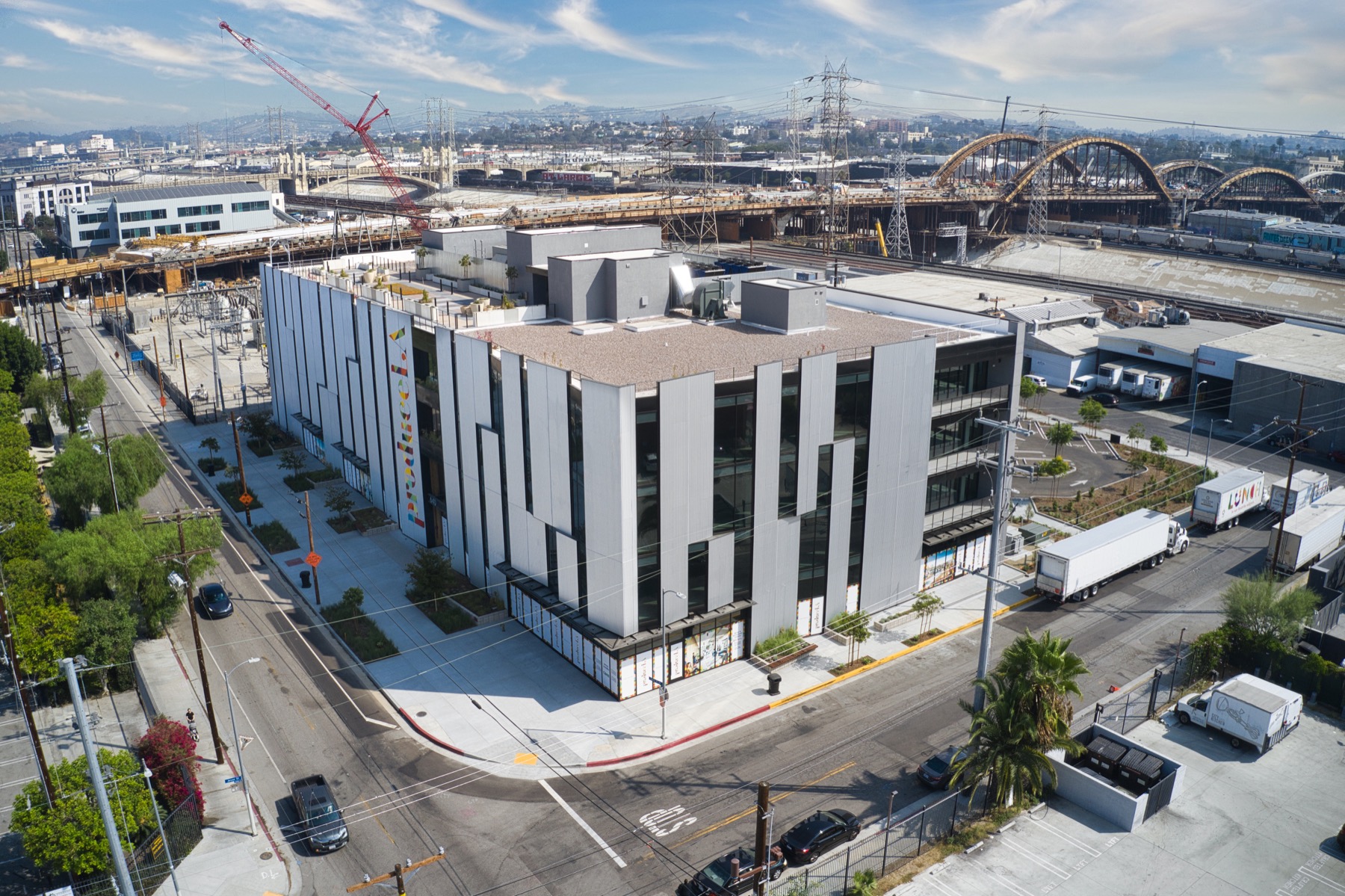 Aerial view placing the completed building within its surrounding industrial neighborhood