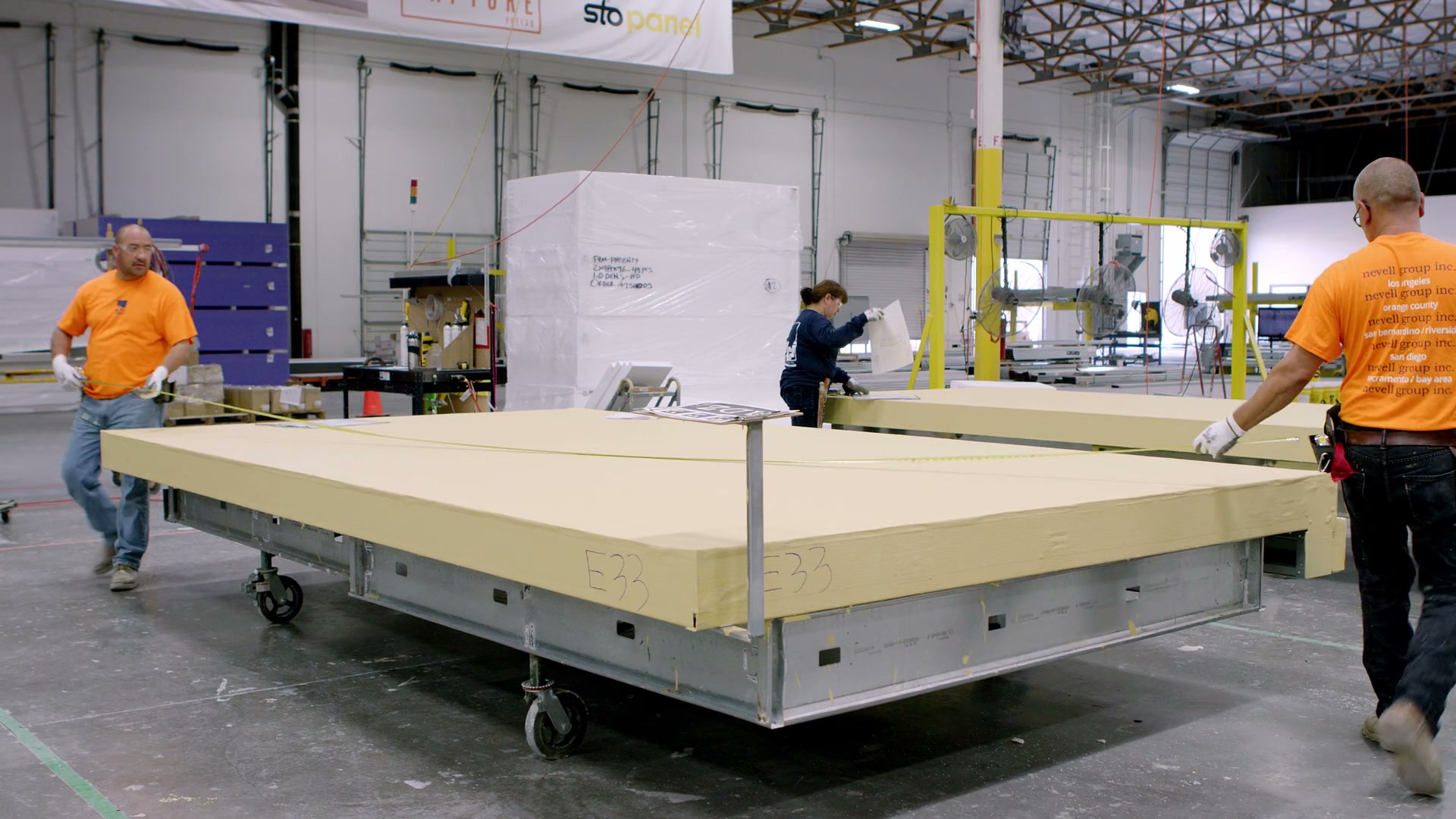 Factory team working together on a prefabricated panel